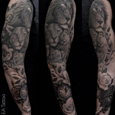 Lion family and roses in sleeve  by LEA Tattoo