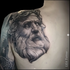 Greek statue head in black & gray  by LEA Tattoo