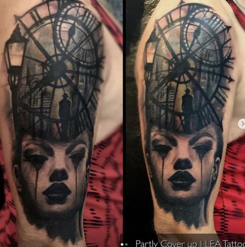 Clock with a view in color (coverup) and face underneath in black & grey.