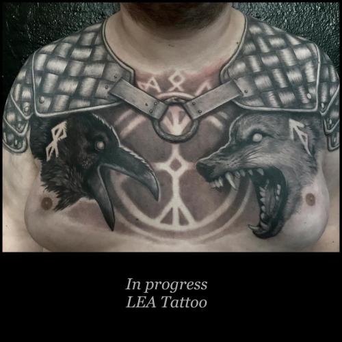 Shoulder armour and Viking theme with Wolf (Fenris) and Raven (Hugin) with binding runes. In background the protective rune The Terror Helmet (skräckhjälmen). 